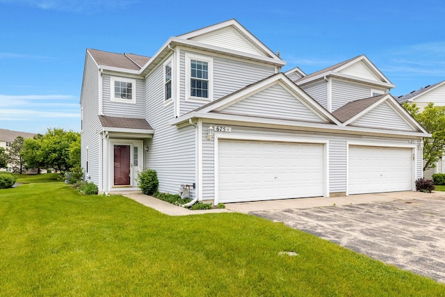 675 Fieldcrest Dr Unit 1A, South Elgin, IL 60177 - view of front of home featuring driveway, a front yard, and a shingled roof