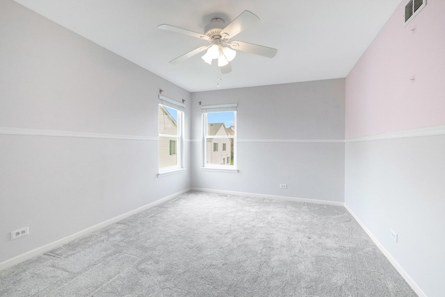 675 Fieldcrest Dr Unit 1A, South Elgin, IL 60177 - carpeted spare room with a ceiling fan and baseboards