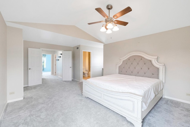 675 Fieldcrest Dr Unit 1A, South Elgin, IL 60177 - bedroom with lofted ceiling, light carpet, baseboards, and ensuite bath