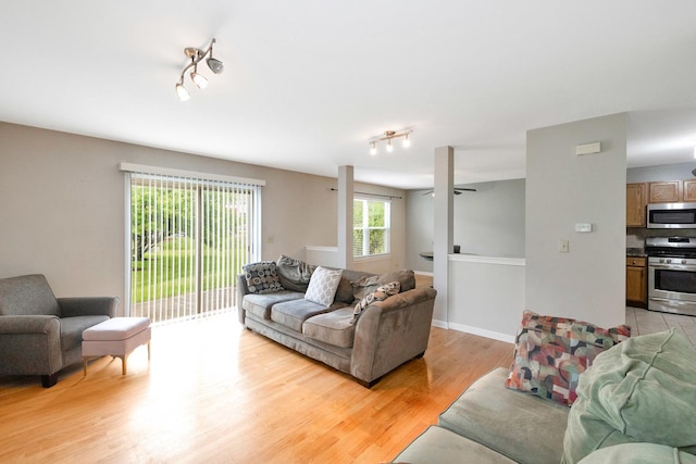 675 Fieldcrest Dr Unit 1A, South Elgin, IL 60177 - living area with rail lighting and light wood finished floors