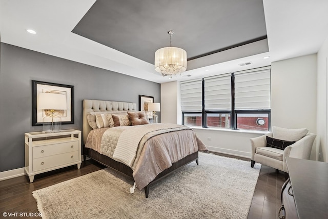 1018 N Larrabee St Unit 3S, Chicago, IL 60610 - bedroom featuring baseboards, a tray ceiling, a chandelier, dark wood-style floors, and recessed lighting