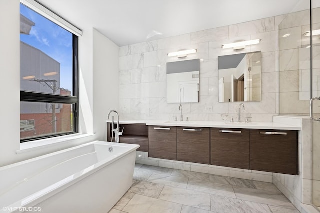 1018 N Larrabee St Unit 3S, Chicago, IL 60610 - full bathroom featuring double vanity, a soaking tub, marble finish floors, tile walls, and an enclosed shower