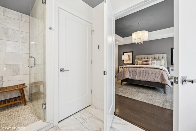 1018 N Larrabee St Unit 3S, Chicago, IL 60610 - ensuite bathroom featuring a shower stall, marble look tiles, and a chandelier