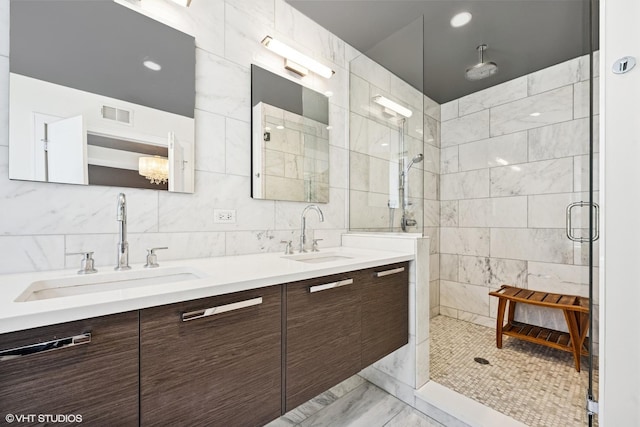 1018 N Larrabee St Unit 3S, Chicago, IL 60610 - full bath with tile walls, a shower stall, double vanity, and marble finish floors