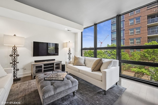 1018 N Larrabee St Unit 3S, Chicago, IL 60610 - living room with healthy amount of natural light, wood finished floors, expansive windows, and baseboards