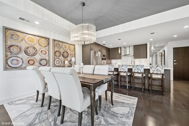 1018 N Larrabee St Unit 3S, Chicago, IL 60610 - dining room featuring recessed lighting, a chandelier, dark wood-style flooring, and baseboards