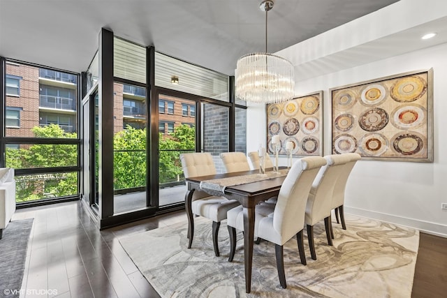 1018 N Larrabee St Unit 3S, Chicago, IL 60610 - dining room with a wall of windows, a chandelier, wood finished floors, and baseboards