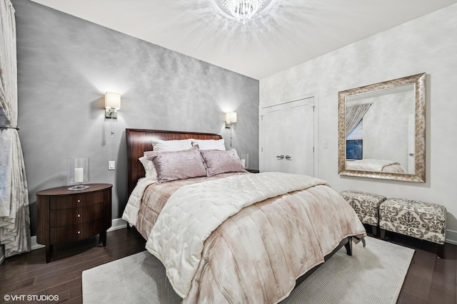 1018 N Larrabee St Unit 3S, Chicago, IL 60610 - bedroom featuring wood finished floors, baseboards, and a closet