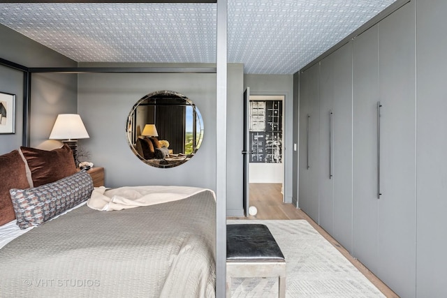 5445 N Sheridan Rd Unit 2715, Chicago, IL 60640 - bedroom with wood finished floors and a closet