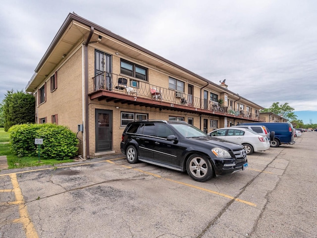 17 King Arthur Ct Unit 7, Northlake, IL 60164 - view of property featuring uncovered parking