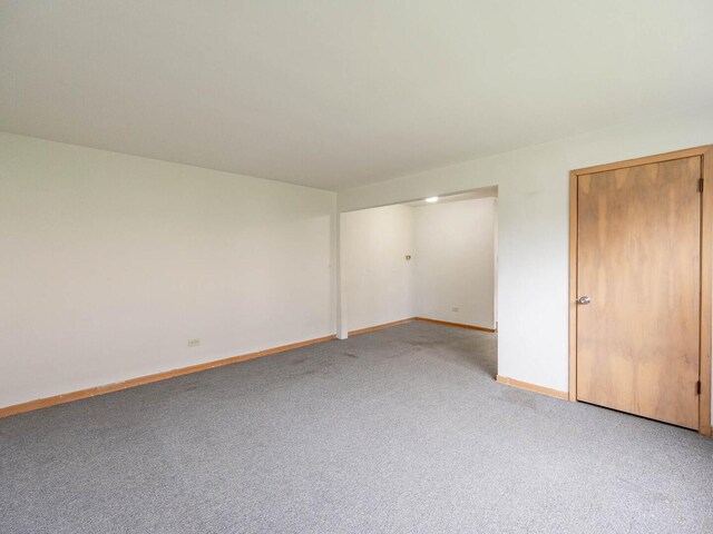 17 King Arthur Ct Unit 7, Northlake, IL 60164 - empty room with light carpet and baseboards