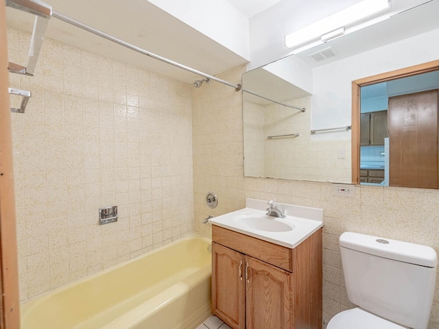 17 King Arthur Ct Unit 7, Northlake, IL 60164 - full bathroom featuring tile walls, bathing tub / shower combination, toilet, vanity, and backsplash