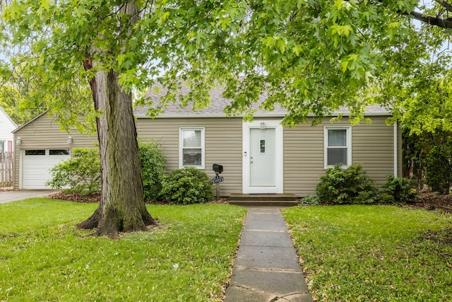 1822 Kelly Ave, Crest Hill, IL 60403 - view of front of home with a front lawn, a garage, and a shingled roof