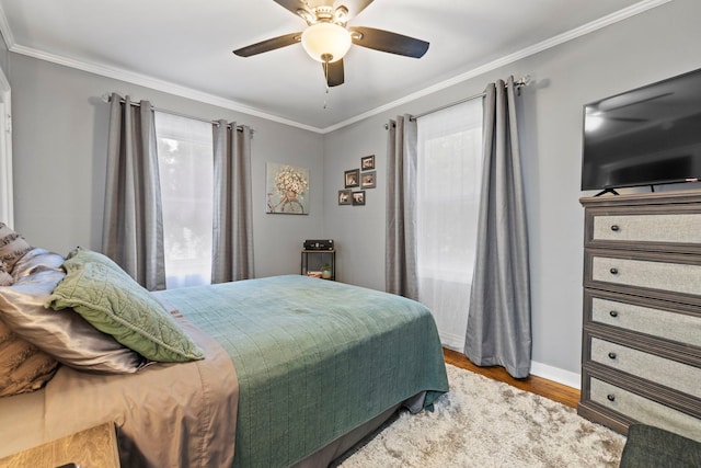 1822 Kelly Ave, Crest Hill, IL 60403 - bedroom featuring wood finished floors, crown molding, baseboards, and ceiling fan