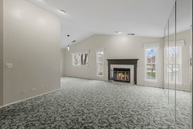 1406 Aldgate Ct Unit D2, Wheeling, IL 60090 - unfurnished living room with carpet, plenty of natural light, a glass covered fireplace, baseboards, and vaulted ceiling