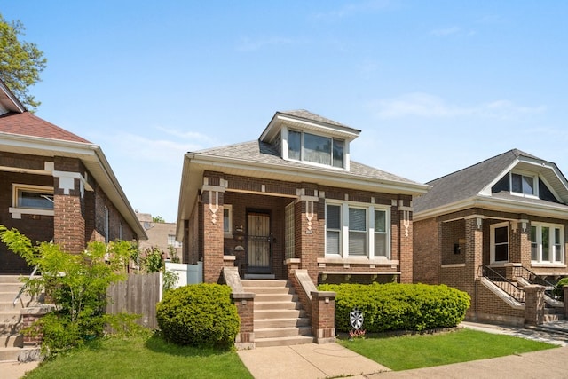 2403 Highland Ave, Berwyn, IL 60402 - view of front of house with brick siding, a porch, and stairway