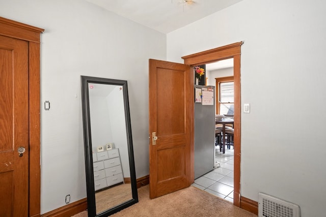 2403 Highland Ave, Berwyn, IL 60402 - bedroom with light colored carpet, baseboards, and light tile patterned flooring