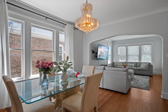 2403 Highland Ave, Berwyn, IL 60402 - dining room with arched walkways, plenty of natural light, and a chandelier