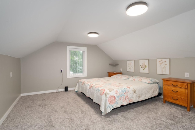 709 S Oak St, Bloomington, IL 61701 - carpeted bedroom with lofted ceiling and baseboards