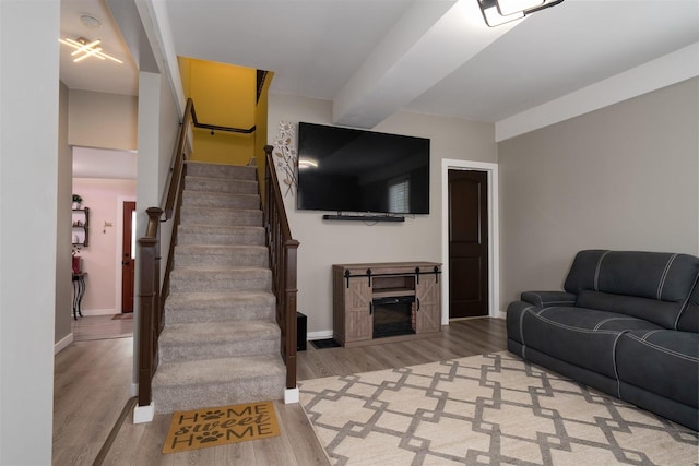 709 S Oak St, Bloomington, IL 61701 - living room featuring wood finished floors, stairway, and baseboards