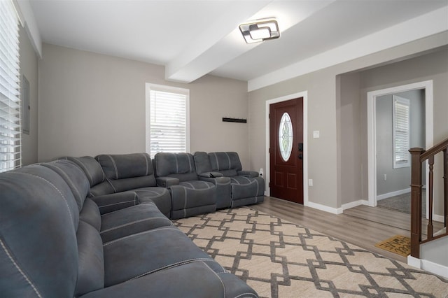 709 S Oak St, Bloomington, IL 61701 - living room featuring light wood-style floors, plenty of natural light, baseboards, and stairs