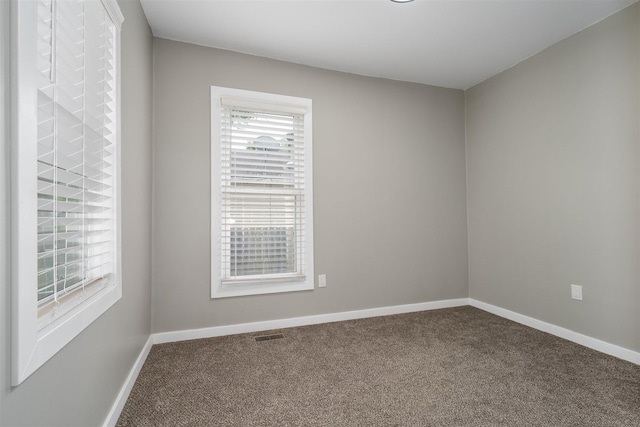 709 S Oak St, Bloomington, IL 61701 - empty room with carpet and baseboards
