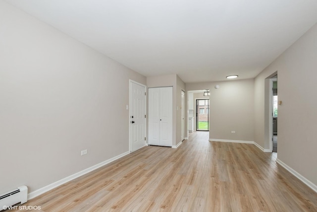4572 W 131st St Unit 1N, Alsip, IL 60803 - empty room with baseboard heating, light wood-type flooring, and baseboards