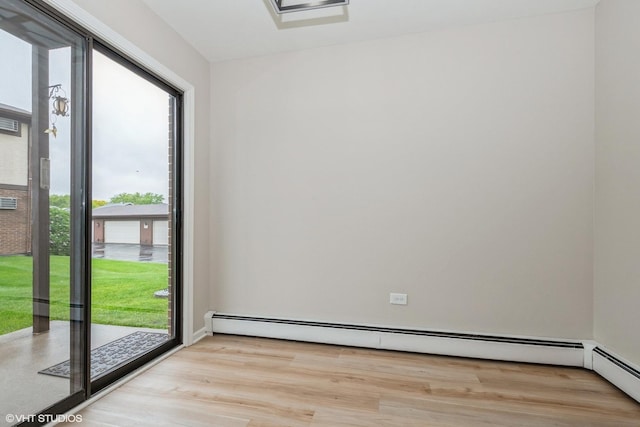 4572 W 131st St Unit 1N, Alsip, IL 60803 - unfurnished room with light wood-style floors and a baseboard heating unit
