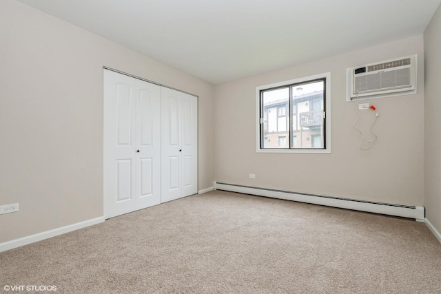 4572 W 131st St Unit 1N, Alsip, IL 60803 - unfurnished bedroom featuring a baseboard radiator, carpet flooring, a wall mounted air conditioner, a closet, and baseboards