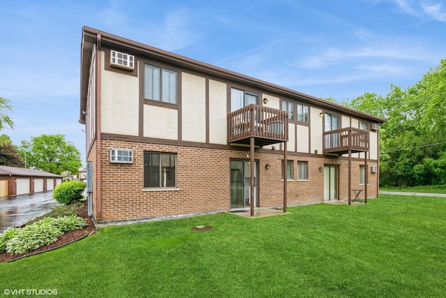 4572 W 131st St Unit 1N, Alsip, IL 60803 - back of house with a balcony, a yard, stucco siding, and brick siding