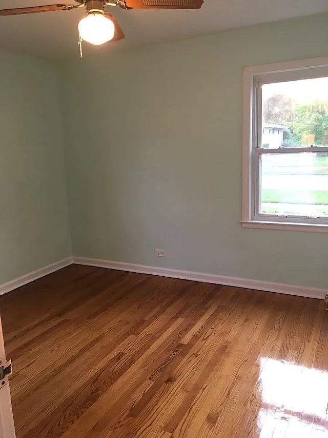 142 E Grove St, Lombard, IL 60148 - spare room with ceiling fan, dark wood finished floors, and baseboards