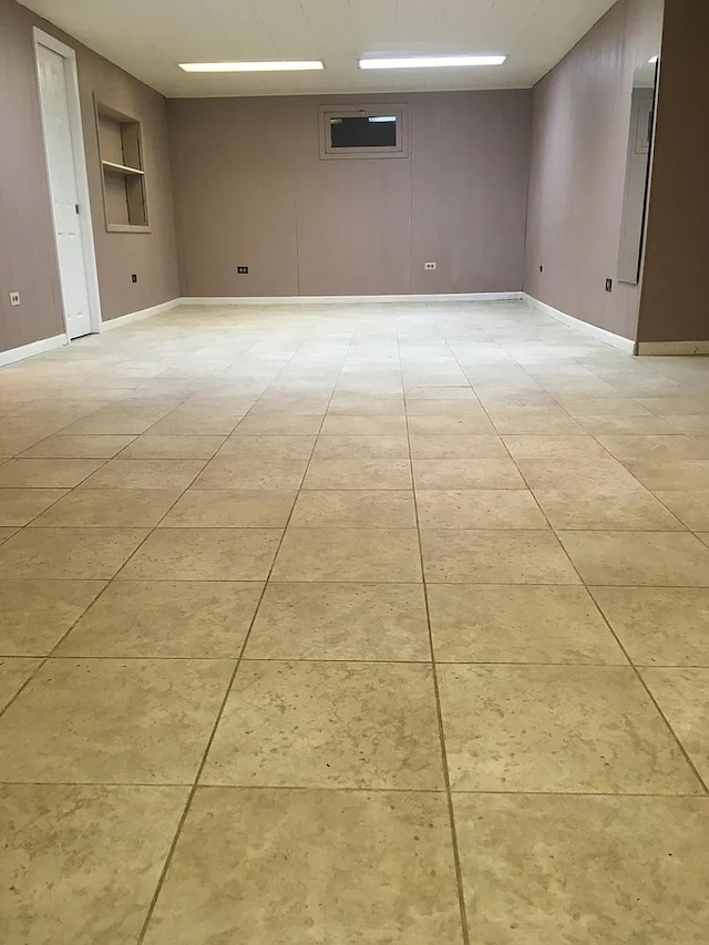142 E Grove St, Lombard, IL 60148 - spare room featuring light tile patterned floors and baseboards