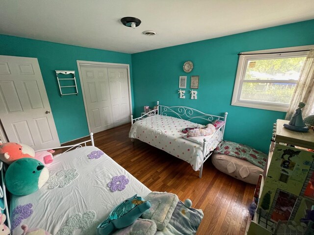 165 Kathleen Dr, Elgin, IL 60123 - bedroom with wood finished floors, a closet, and baseboards
