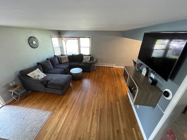 165 Kathleen Dr, Elgin, IL 60123 - living area featuring a baseboard heating unit, wood finished floors, and baseboards