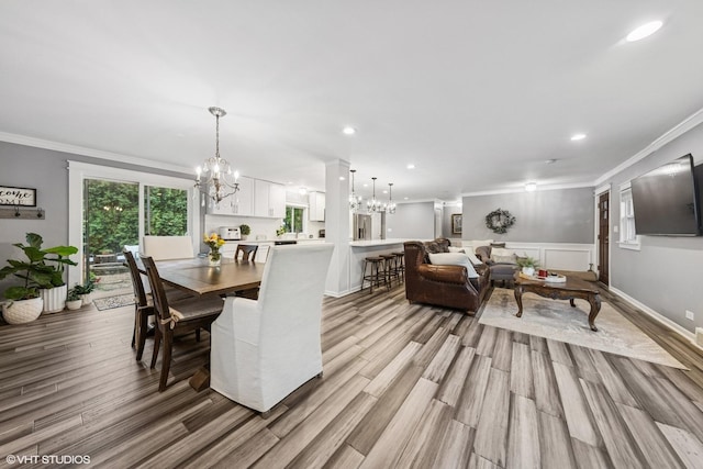 805 S Main St, Wheaton, IL 60189 - dining room featuring a chandelier, ornamental molding, light wood-style flooring, recessed lighting, and wainscoting
