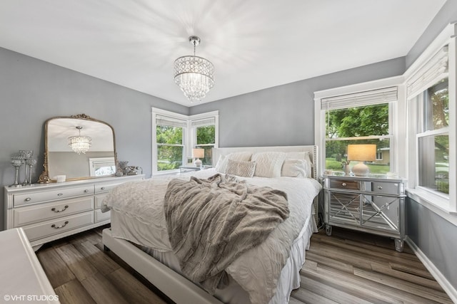 805 S Main St, Wheaton, IL 60189 - bedroom featuring a chandelier and dark wood-style floors