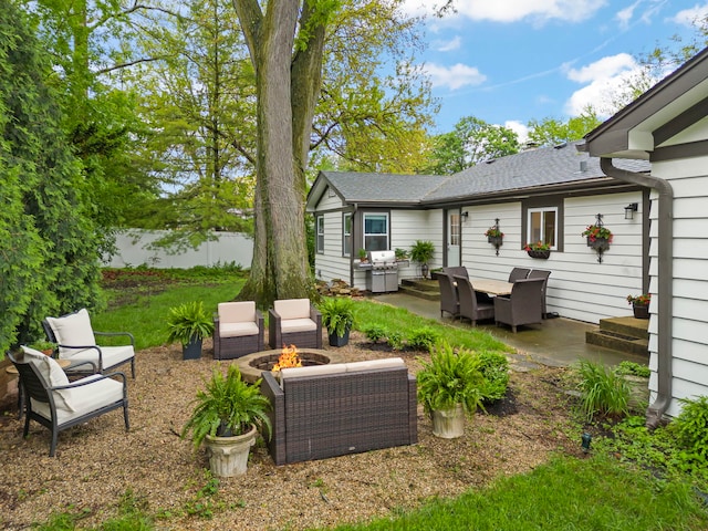 805 S Main St, Wheaton, IL 60189 - view of yard with a patio and an outdoor living space with a fire pit