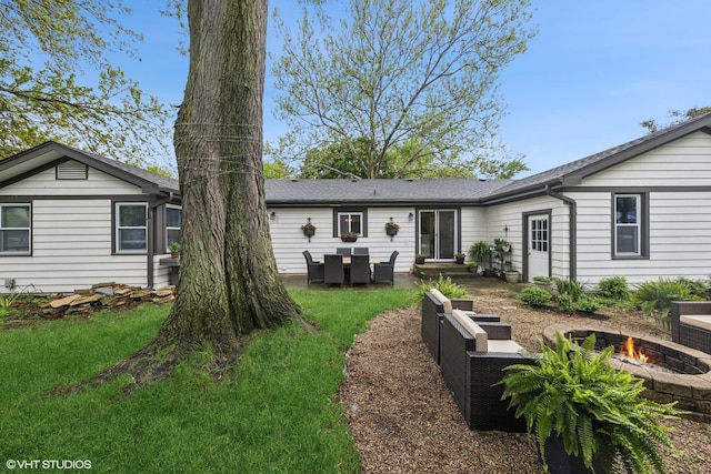 805 S Main St, Wheaton, IL 60189 - back of property with an outdoor fire pit, a yard, a patio, and roof with shingles