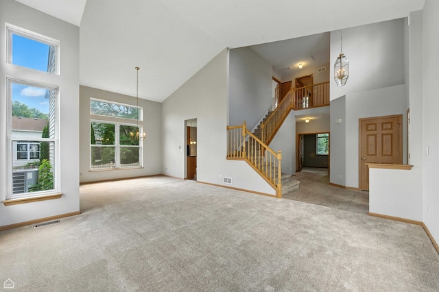 16517 Newbury Ct, Crest Hill, IL 60403 - unfurnished living room with high vaulted ceiling, carpet flooring, and stairway