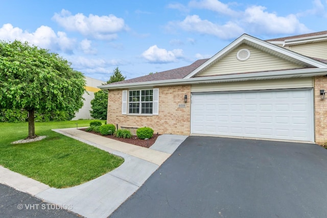 6016 W Kennedy Ct, Monee, IL 60449 - view of front of home featuring brick siding, asphalt driveway, a front yard, and an attached garage
