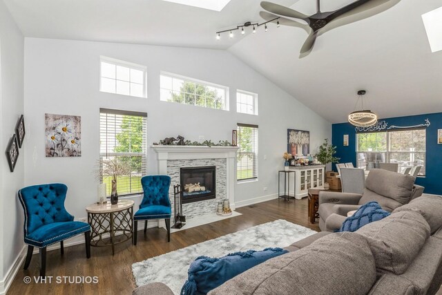 6016 W Kennedy Ct, Monee, IL 60449 - living room featuring ceiling fan, wood finished floors, healthy amount of natural light, a skylight, and high vaulted ceiling