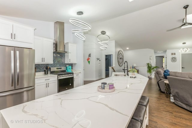 6016 W Kennedy Ct, Monee, IL 60449 - kitchen featuring appliances with stainless steel finishes, range hood, a sink, tasteful backsplash, and open floor plan