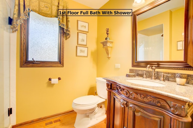 13711 83rd Ave, Orland Park, IL 60462 - bathroom featuring toilet, vanity, wood finished floors, and baseboards