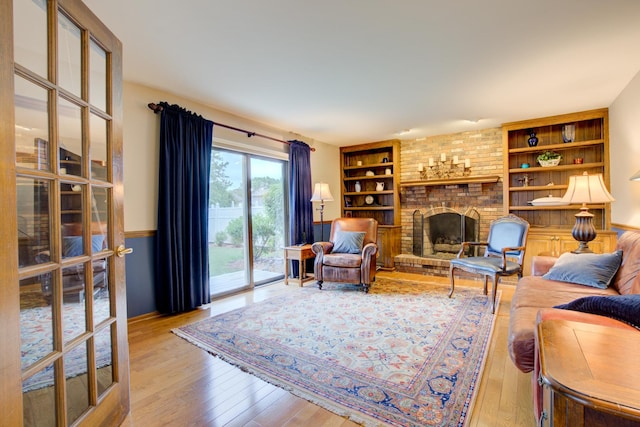 13711 83rd Ave, Orland Park, IL 60462 - living area featuring hardwood / wood-style floors, built in shelves, and a fireplace