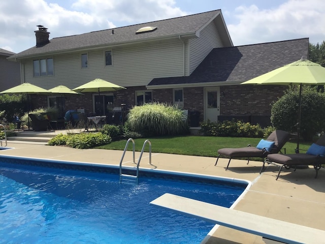 13711 83rd Ave, Orland Park, IL 60462 - swimming pool featuring a diving board, a patio, and a yard