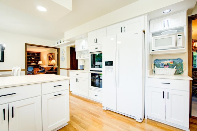 13711 83rd Ave, Orland Park, IL 60462 - kitchen featuring white appliances, white cabinetry, light wood-type flooring, light countertops, and recessed lighting