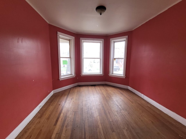 5732 S Sangamon St, Chicago, IL 60621 - spare room with baseboards and wood-type flooring
