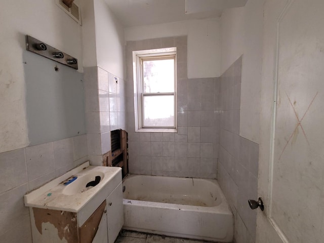 5732 S Sangamon St, Chicago, IL 60621 - bathroom featuring tile walls, a bathtub, and vanity