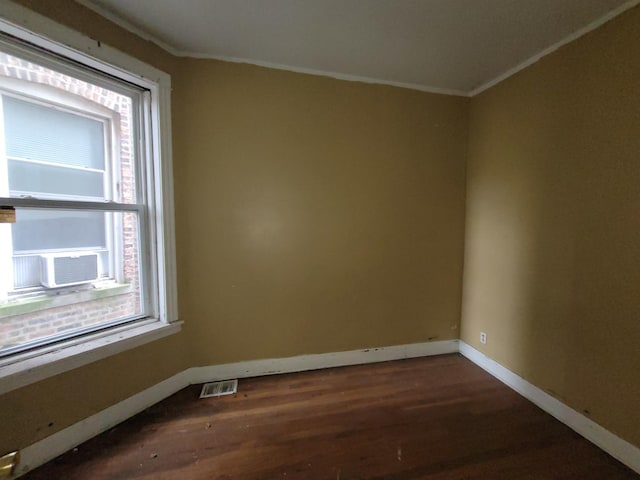 5732 S Sangamon St, Chicago, IL 60621 - empty room featuring ornamental molding, dark wood-style flooring, baseboards, and cooling unit