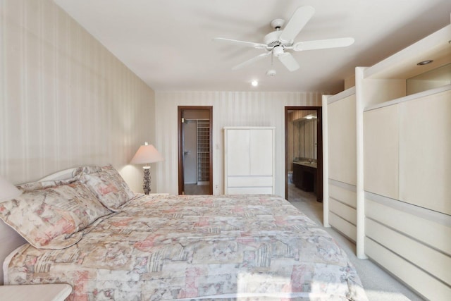 6400 N Cicero Ave Unit 404, Lincolnwood, IL 60712 - carpeted bedroom featuring wallpapered walls, a spacious closet, connected bathroom, a ceiling fan, and a closet